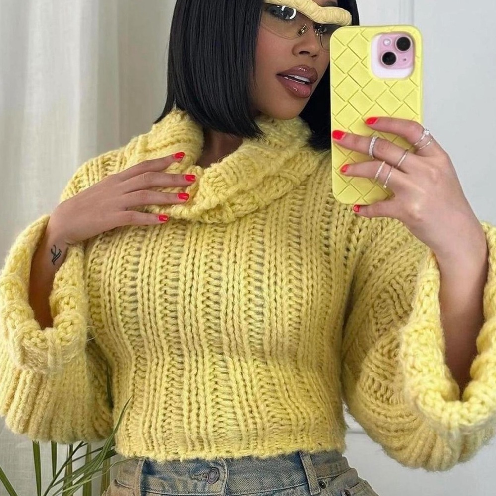Yellow cable knit cropped sweater.